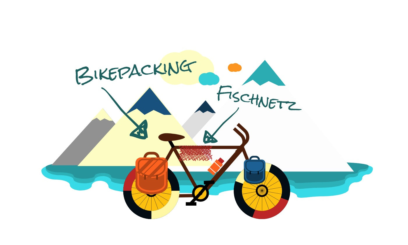 A bikepacking bike in front of a lake and mountains. A Fischnetz is hanging on the bike to dry.